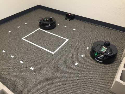 two Kobuki mobile bases; one with Hokuyo laser range finder and Raspberry Pi 3 Model B mounted